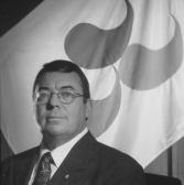'Robert D Steadward in front of old IPC flag' logo