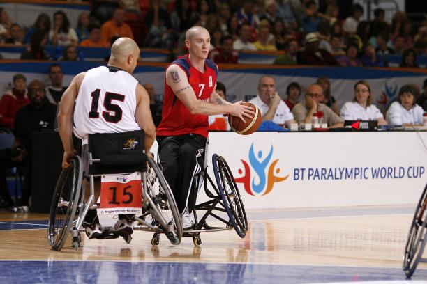 A picture of a person in a wheelchair playing basketball
