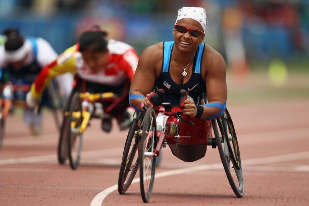 A picture of a woman in wheelchair celebrating her victory 