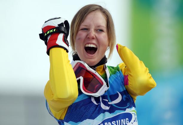 A picture of a woman celebrating her victory