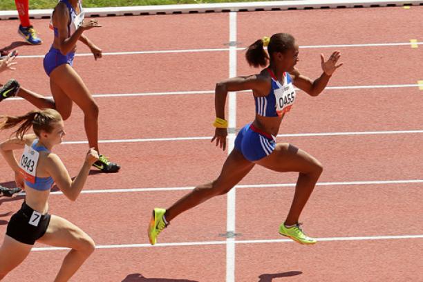 Mandy Francois-Elie sprinting on a tartan track leading the field.
