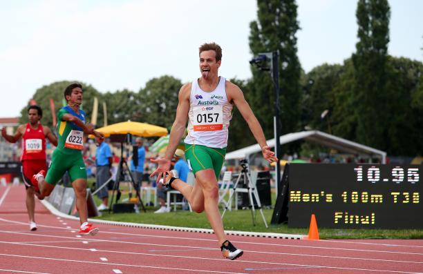 Evan O'Hanlon Lyon Man crossing a finish line in a stadium, celebrating