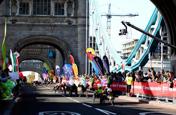 Men's wheelchair racers cross Tower Bridge in the 2014 Virgin Money London Marathon