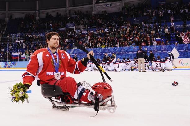 Dmitry Lisov Russian ice sledge hockey player Dmitry Lisov takes his silver medal in stride on the ice at the Sochi 2014 Paralympics.