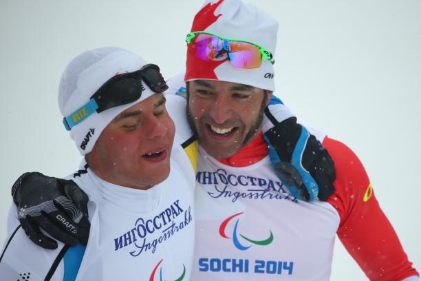 Zebastian Modin and Brian McKeever Two athletes embrace each other for a close-up photo.