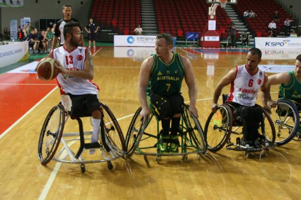 Australia Turkey Wheelchair basketball world championships 2014 Three wheelchair basketball players fight for the ball