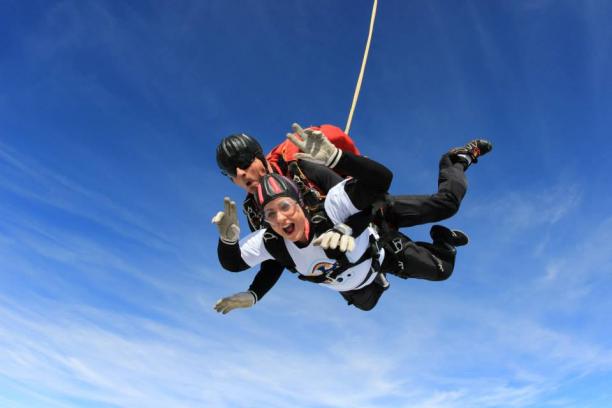 Natasha Baker Skydive woman and man falling from a plane in a skydive