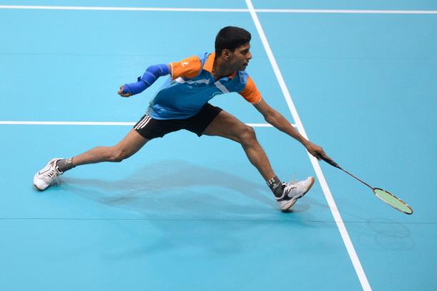 Man playing badminton