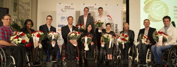 Swiss athletes honoured athletes holding flowers facing the camera