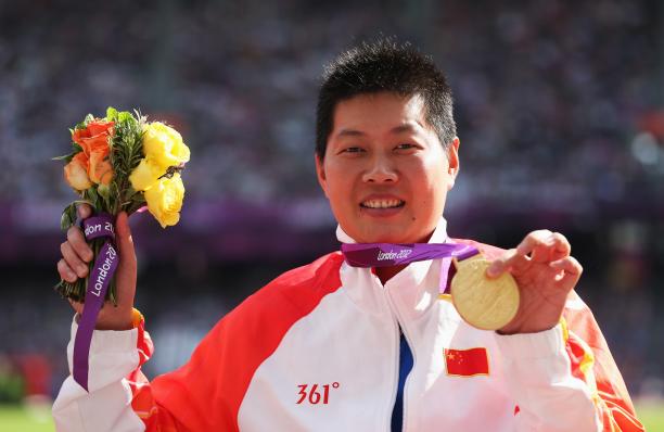 Liwan Yang China London 2012 Portrait shot of women showing her medal to the camera.