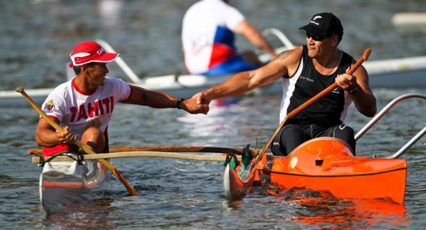 Para-Canoe A picture of 2 men in a canoe shaking their hands celebrating a victory