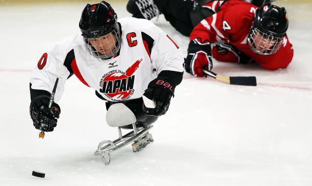 Japanese Ice Sledge Hockey player performing against Canada at Vancouver 2010
