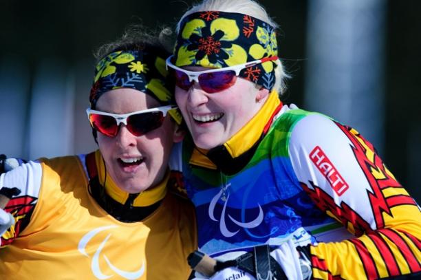 Courtney Knight posing with her guide Andrea Bundon at the 2012 Vancouver Paralympic Winter Games