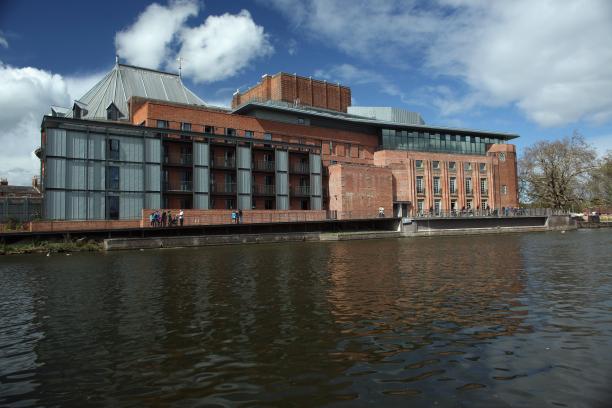 A picture of a building next to a river