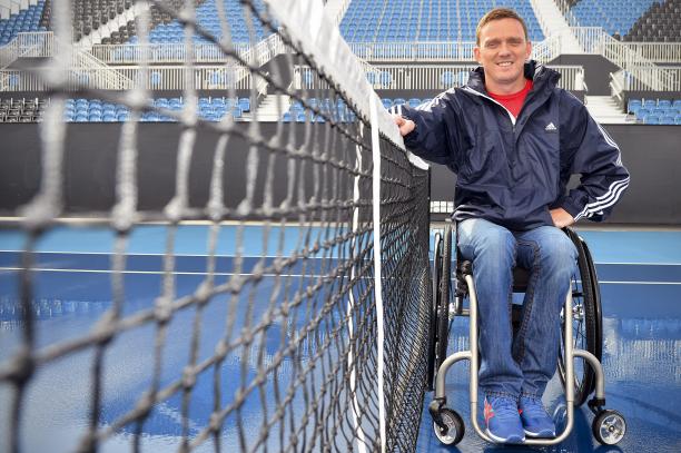 Jamie Birdekin, member of the GB Wheelchair Tennis team and Paralympic bronze medallist at Beijing 2008 visits Eton Manor A picture of an athlete in a wheelchair next to a tennis let.