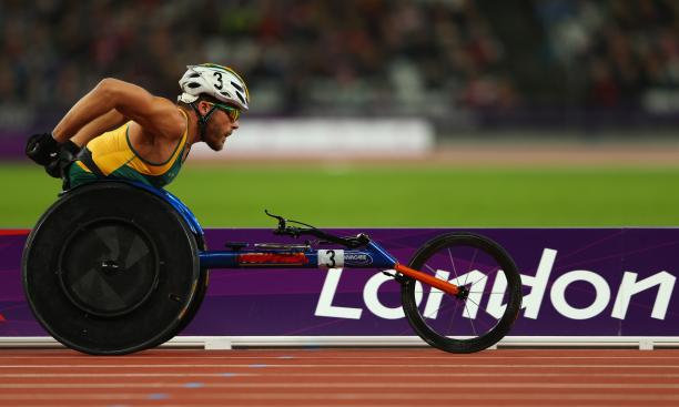 A picture of a man in a wheelchair racing during an athletics event