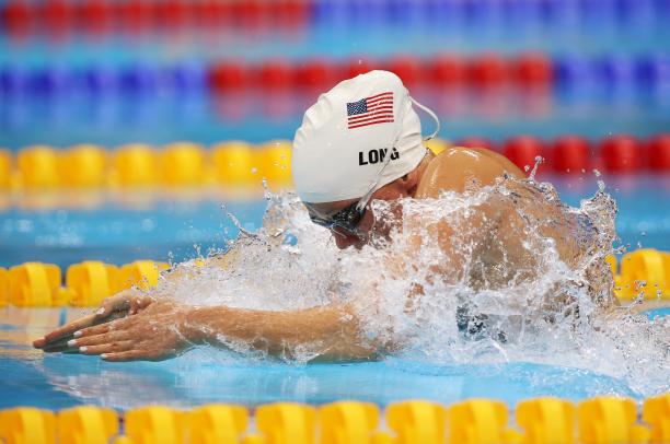 Jessica Long A picture of a woman in the pool with her head and hands above the surface