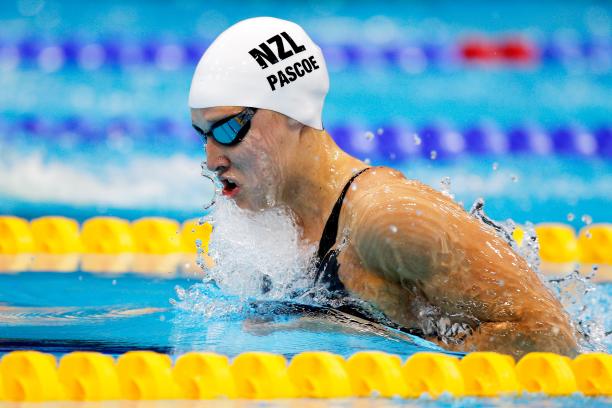 A picture of a woman in the pool with her head and shoulders above the surface