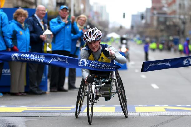 Tatyana McFadden of the United States crosses the finish line to win the women's push rim wheelchair division of the 119th Boston Marathon on April 20, 2015 in Boston, Massachusetts.