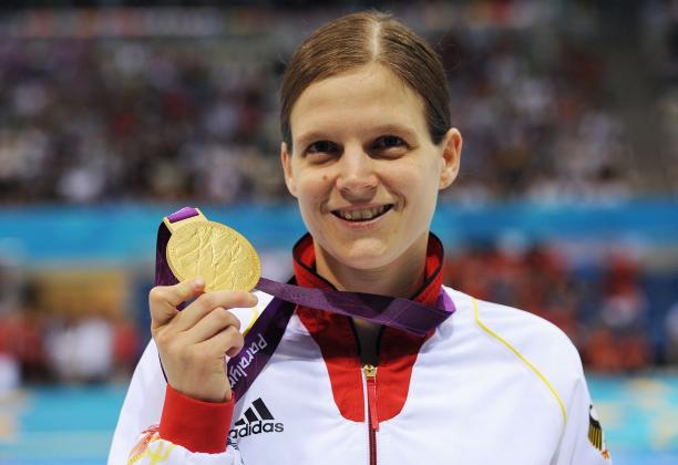 Germany's Daniela Schulte at London 2012 Portrait shot of woman showing a medal and smiling