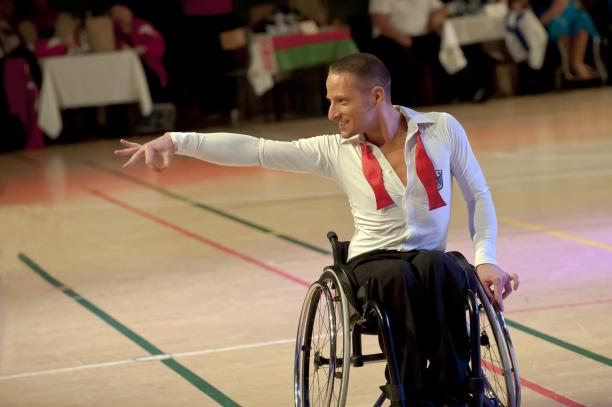 Erik Machens Germany wheelchair dance sport Man in wheelchair doing a dancing pose
