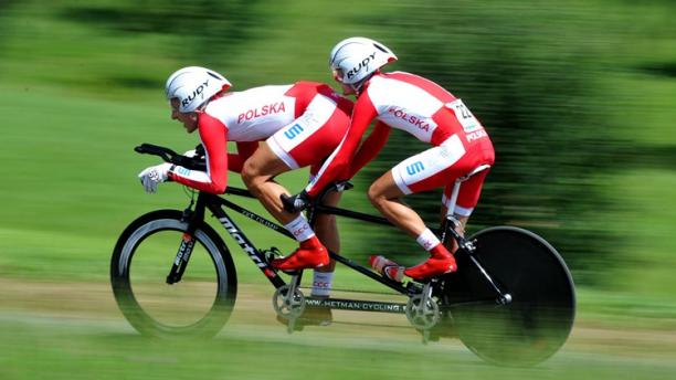 Marcin Polak and pilot Michal Ladosz Poland cycling Two men cycling on a tandem in a race jersey