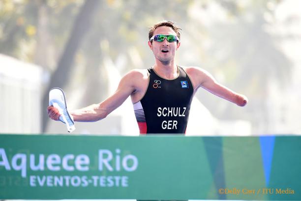 Germany's Martin Schulz at Rio 2016 triathlon test event Man with an arm amputation crossing a finish line