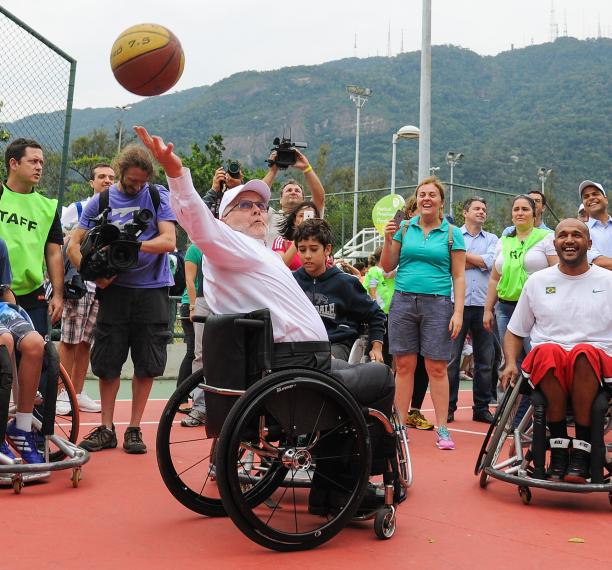 IPC president Sir Philip, a five-time Paralympian in wheelchair basketball, shows them how it's done.
