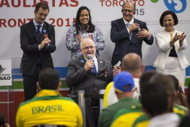 Sir Philip Craven visits Brazil’s new Paralympic training centre in Sao Paulo Man in wheelchair talking, people listening to him, applauding