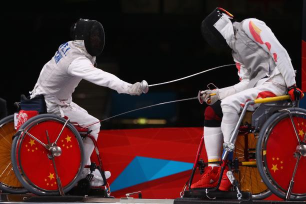 Ruyi Ye Ruyi Ye (L) of China on his way to winning gold against Yijun Chen (R) of China during the men's individual foil category A final of the wheelchair fencing at the London 2012 Paralympic Games.