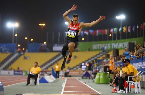 Markus Rehm a male from Germany wearing red and black clothes competing in the long jump