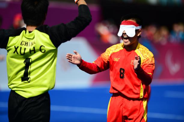 Blindfolded football player celebrates