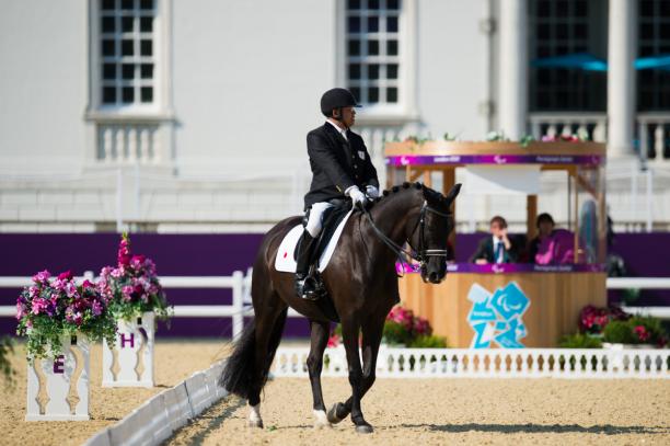 Nobumasa Asakawa - Equestrian - London 2012 Paralympic Games Man on horse riding in a stadium