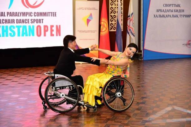 Man and woman in wheelchairs dancing