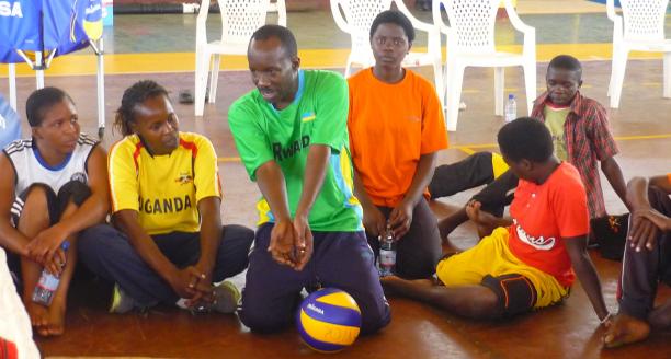 Man explaining how to play sitting volleyball