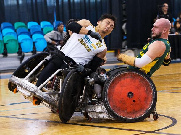 Japan's Yukinobu Ike and Australia's Chris Bond - wheelchair rugby Two men playing wheelchair rugby collide their chairs.