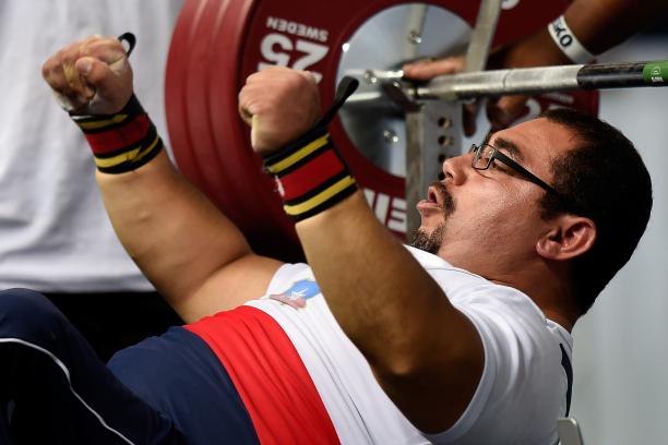 Juan Carlos Garrido - Chile - Powerlifting Chilean powerlifter Juan Carlos Garrido is on the bench and raises his hands celebrating his win.