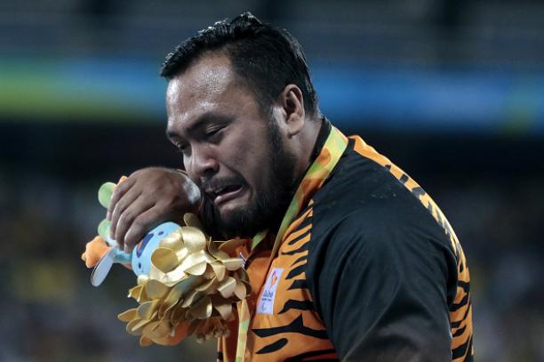 Gold medalist Muhammad Ziyad Zolkefli of Malaysia celebrate on the podium