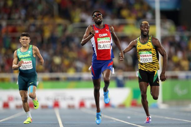 Three men finishing in the men's 400m competition 