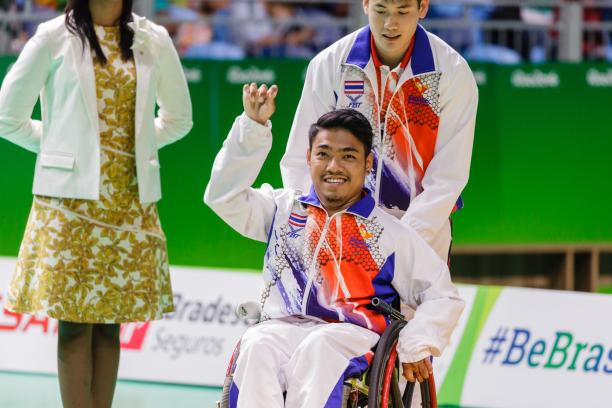 Man in wheelchair celebrating