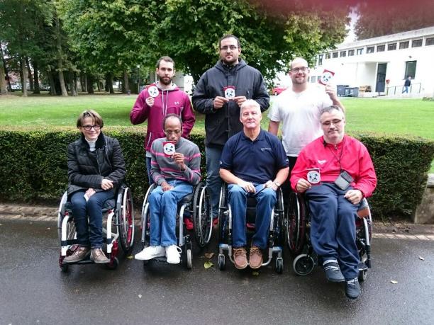 IPC Powerlifting National Referee course Five people in wheelchairs and standing pose with certificates