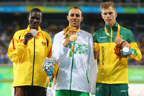 David Emong - Uganda Uganda's track and field athlete David Emong celebrates on the podium with the gold and bronze medallists.
