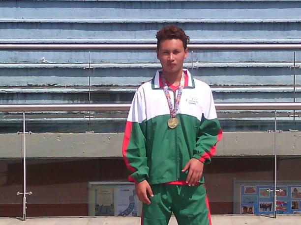 Diego Maldonado A swimmer poses with a medal