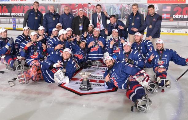A Para ice hockey team celebrate their victory