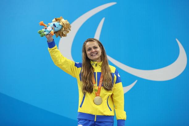 Gold medalist Anna Stetsenko of Ukraine celebrates on the podium at the medal ceremony for the Women's 100m Backstroke - S13 on day 10 of the Rio 2016 Paralympic Games