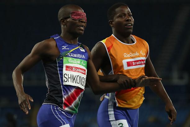 Ananias Shikongo and his guide Even Tjiviju of Namibia celebrates winning the gold medal in the Men's 200m - T11 Final at the Rio 2016 Paralympic Games.