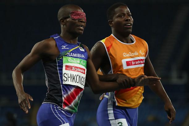 Ananias Shikongo Ananias Shikongo and his guide Even Tjiviju of Namibia celebrates winning the gold medal in the Men's 200m - T11 Final at the Rio 2016 Paralympic Games.