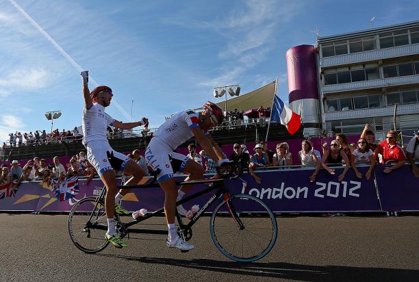 Ivano and Lucca Pizzi of Italy celebrate winning the Men's Individual B Cycling Road Race at the London 2012 Paralympic Games.