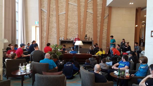 Mark Arendz - Canada - Athlete Representative Man on stage speaking to a group of people