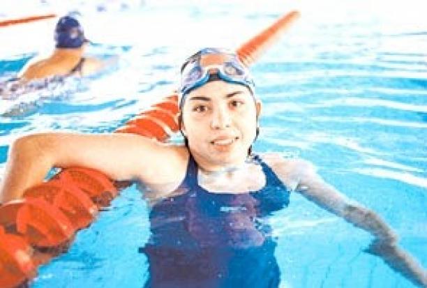 Betiana Basualdo - Atlanta 1996 female swimmer celebrates in pool after winning race